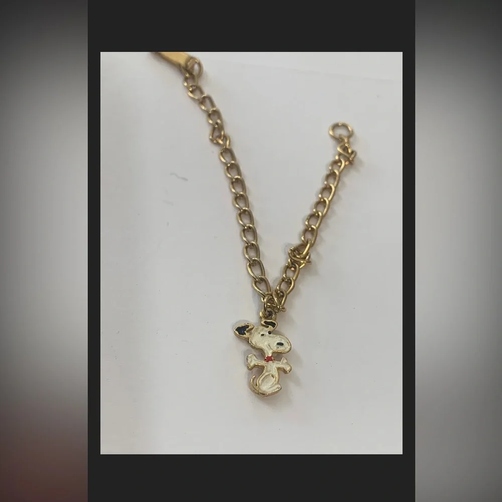 United features vintage gold tone 6” snoopy bracelet